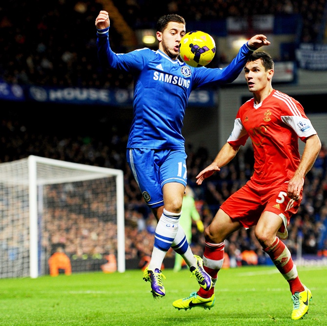 Eden Hazard of Chelsea controls the ball from Dejan Lovren of Southampton