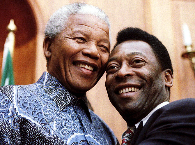 President Nelson Mandela (left) and the world's most famous footballer Pele smile for photographers at Union Buildings in March 1995