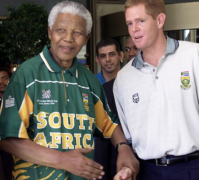 Former South African president Nelson Mandela (left) with Shaun Pollock