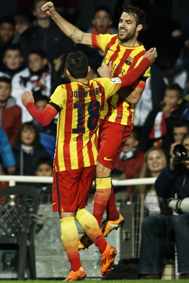 Cesc Fabregas (right) of Barcelona celebrates after scoring with his teammate Jordi Alba
