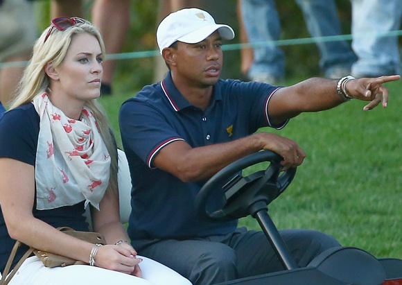 Skier Lindsey Vonn waits with Tiger Woods