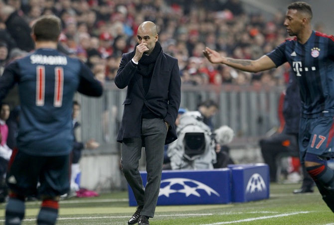 Bayern Munich coach Pep Guardiola (centre) reacts
