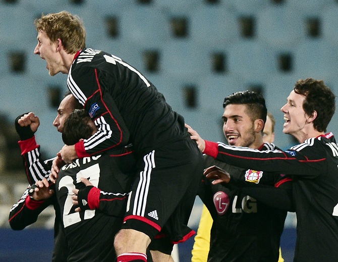 Bayer Leverkusen players celebrate a goal