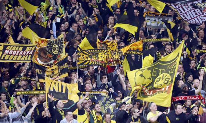 Borussia Dortmund supporters react after their team won their Champions League match
