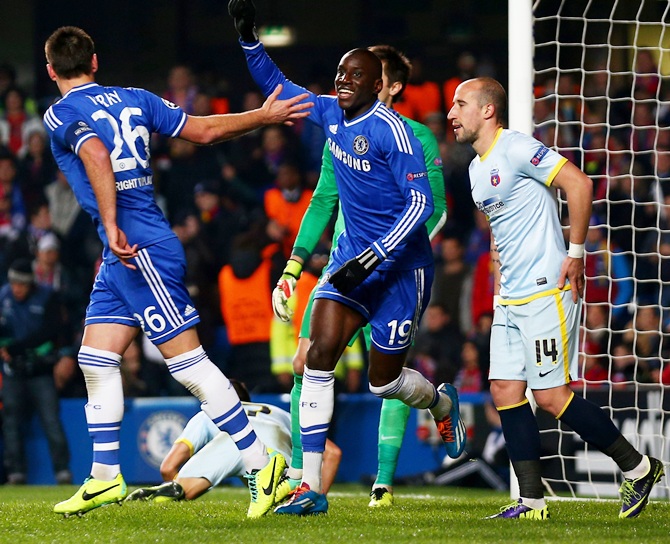 Demba Ba of Chelsea celebrates with teammate John Terry