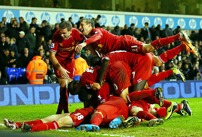 Jon Flanagan of Liverpool is mobbed by his teammates after scoring against Tottenham Hotspur on Sunday