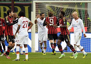 AC Milan's Sulley Muntari (2nd from right) celebrates scoring the second goal against AS Roma during during their Serie A match on Monday