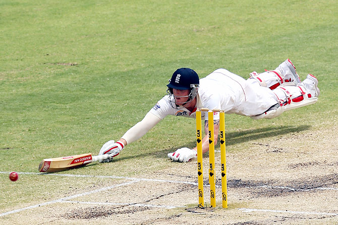 Ben Stokes of England dives to avoid being run out