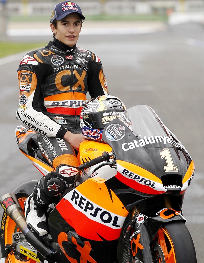 Marc Marquez poses with his motorbike