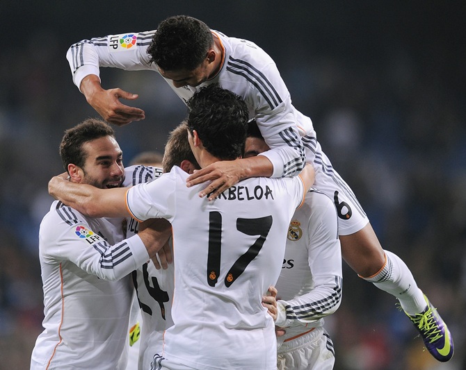 Carlos Casemiro (above) of Real Madrid celebrates with Daniel Carvajal (left) and Alvaro Arbeloa after Real scored their first goal