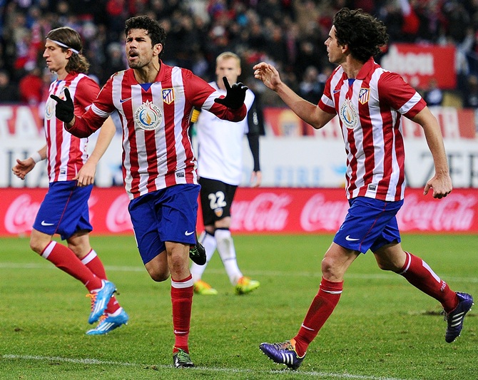 Diego Costa (left) of Club Atletico de Madrid celebrates with Tiago Mendez