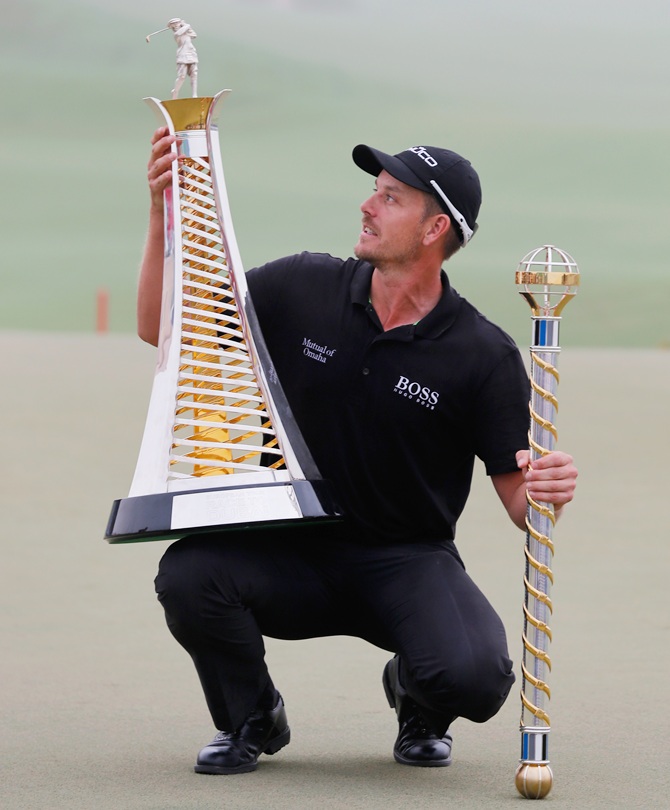 Henrik Stenson of Sweden poses with the Race To Dubai trophy