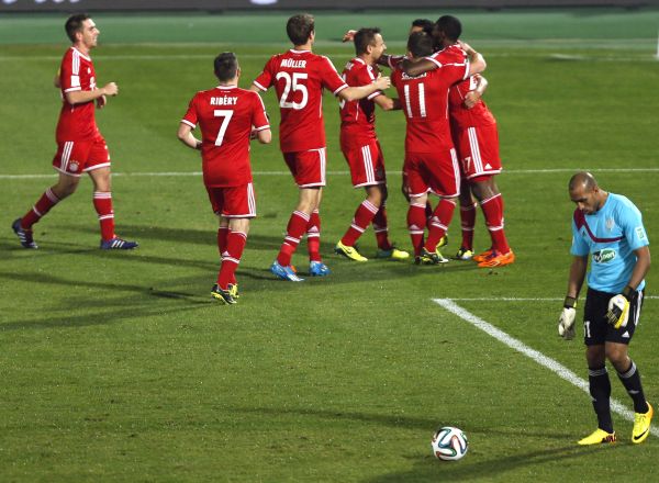 Dante of Germany's Bayern Munich is surrounded by his team mates as they celebrate his goal against Morocco's Raja Casablanca