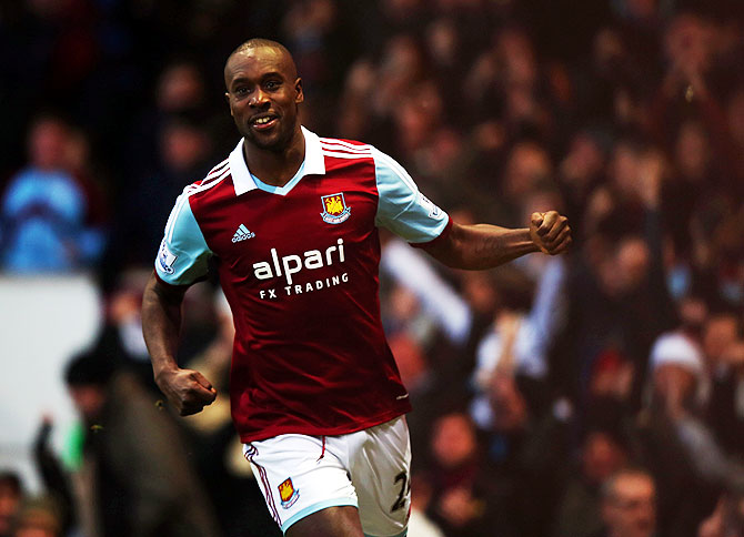 Carlton Cole of West Ham United celebrates as he scores their first goal against Manchester United
