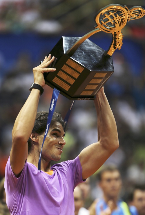 Rafael Nadal of Spain holds up his trophy