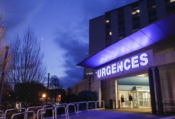 Members of the staff are seen outside the emergency services at the CHU Nord hospital in Grenoble