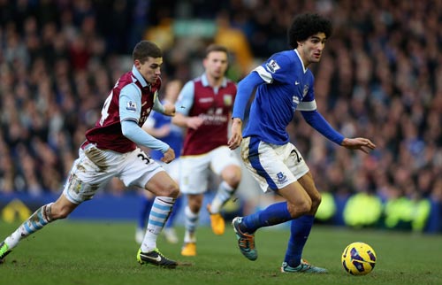 Marouane Fellaini of Everton moves away from Matthew Lowton of Aston Villa during the Barclays Premier League match