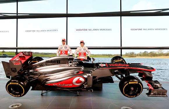 Jenson Button (left) with Sergio Perez