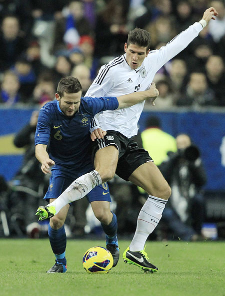 France's Yohan Cabaye (left) and Germany's Mario Gomez vie for possession during their international friendly on Wednesday