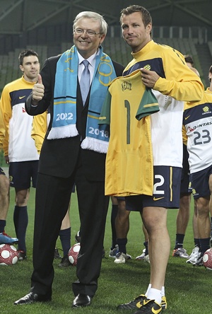 Former Australian Prime Minister Kevin Rudd with Australian captain Lucas Neill