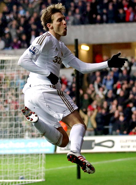 Michu celebrates scoring the opening goal for Swansea