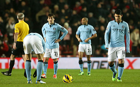 David Silva of Manchester City and Sergio Aguero of Manchester City look dejected after conceding a third goal during their EPL match against Southampton on Saturday