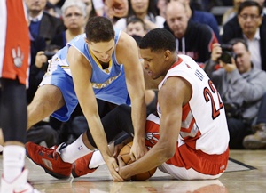 Toronto Raptors Rudy Gay fights for a loose ball against Denver Nuggets' Evan Fournier