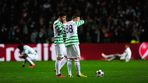 Celtic players Anthony Watt (left) and Gary Hooper look on dejectedly