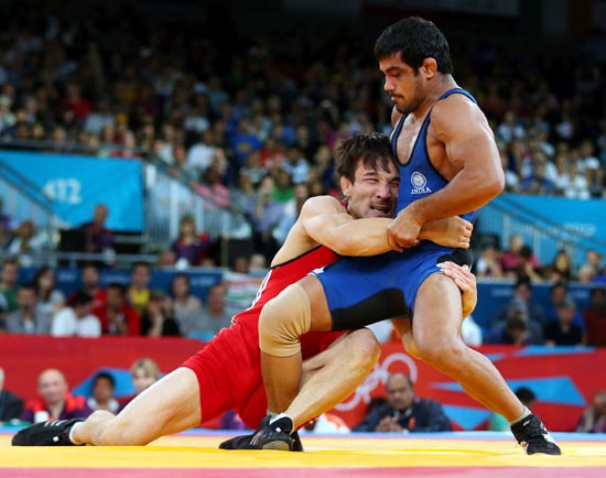 Sushil Kumar of India in action against Akzhurek Tanatarov of Kazakhstan
