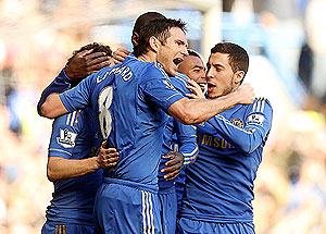 Frank Lampard of Chelsea celebrates with teammates after scoring against Brentford during their FA Cup match on Sunday