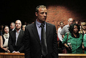 Blade Runner Oscar Pistorius awaits the start of court proceedings in the Pretoria Magistrates court on Tuesday