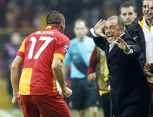 Galatasaray's Burak Yilmaz with his coach Fatih Terim