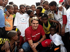 A file photo of Roger Federer with kids of a school funded by his charity