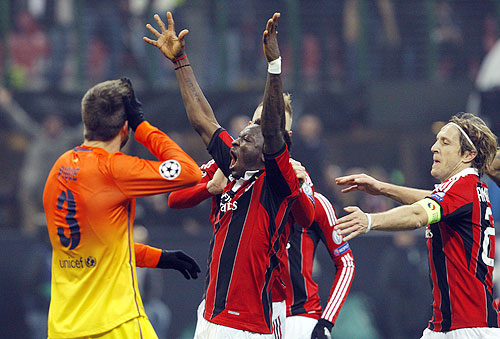 AC Milan's Sulley Muntari (centre) celebrates with teammates after scoring against Barcelona during their Champions League match on Wednesday