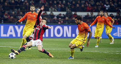 AC Milan's Stephan El Shaarawy (left) misses a scoring opportunity against Barcelona on Wednesday