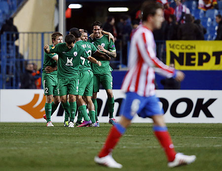 Rubin Kazan's players celebrate a goal against Atletico Madrid