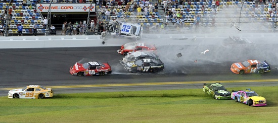 NASCAR driver Kyle Larson (32) and his Chevrolet end up in the fence during the final lap crash during the NASCAR Nationwide Series