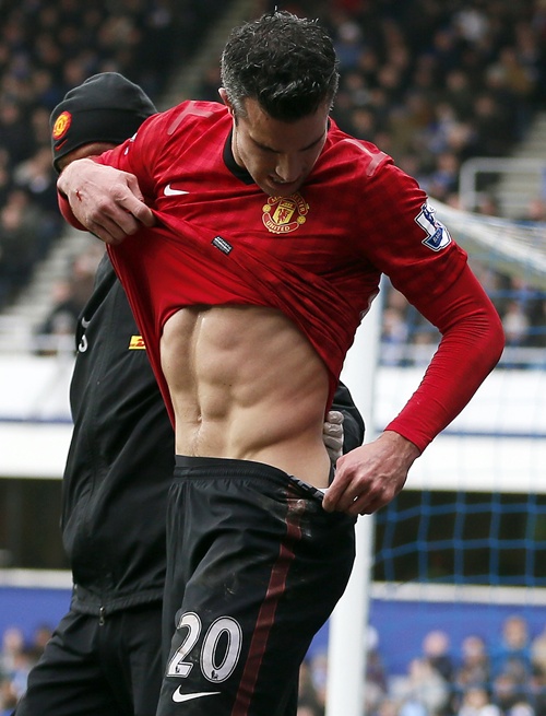 Manchester United's Robin Van Persie checks himself