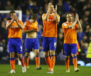 Oldham Athletic's players react after their FA Cup fifth round replay  match against Everton