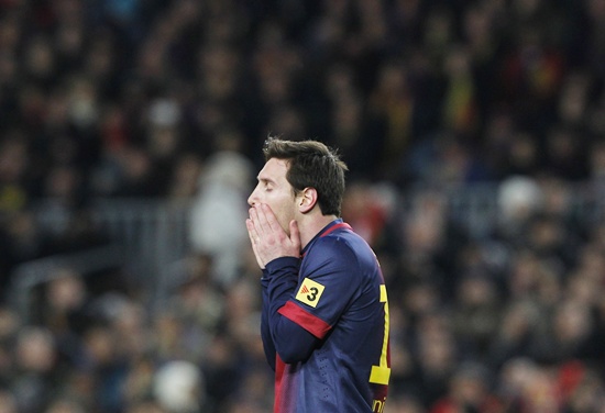 Barcelona's Leonel Messi reacts after missing a chance to score