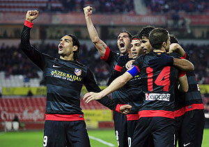 Atletico Madrid's Radamel Falcao (left) celebrates with teammates after scoring against Sevilla during their Spanish King's Cup semi-final second leg match on Wednesday
