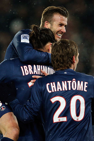 PSG's David Beckham celebrates with teammate Zlatan Ibrahimovic