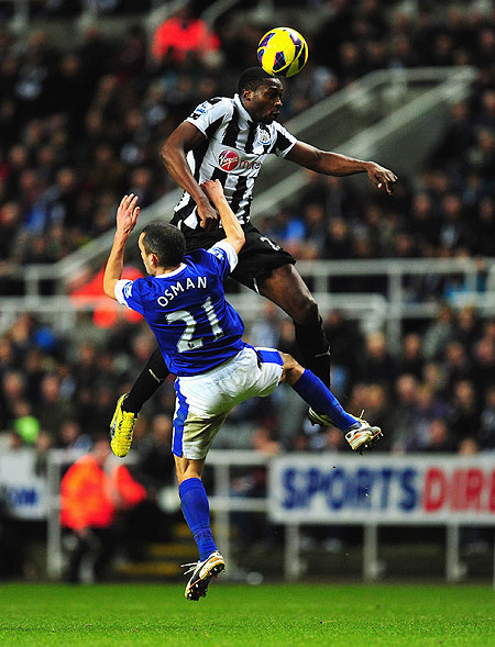 Everton's Leon Osman (left) and Newcastle United's Shola Ameobi during are involved in an aerial duel during their English Premier League match on Wednesday