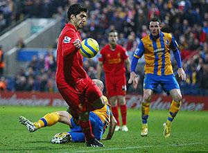 Liverpool's Luis Suarez appears to control the ball with his hand during the FA Cup match against Mansfield Town on Sunday