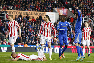 Chelsea's Juan Mata (right) celebrates an own goal from Stoke City's Jonathan Walters (2nd from left) during their English Premier League match at the Britannia Stadium in Stoke-on-Trent, on Saturday