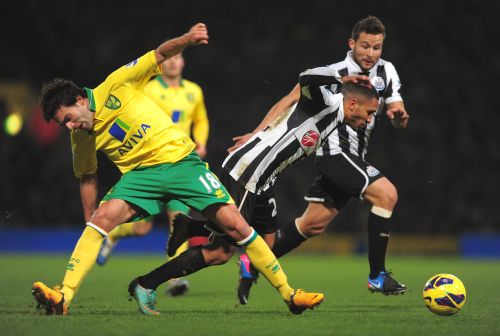 Sylvain Marveaux of Newcastle United battles with Javier Garrido of Norwich City during the Barclays Premier League match between Norwich City and Newcastle United