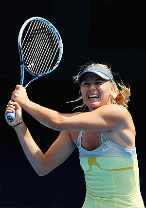 Maria Sharapova of Russia plays a backhand against Olga Puchklova at the Australian Open on Mnday