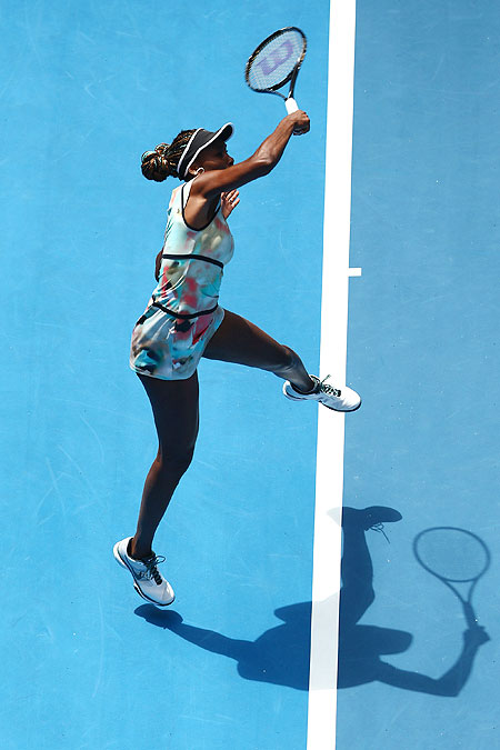 Venus Williams plays a forehand against Galina Voskoboeva of Kazakhstan