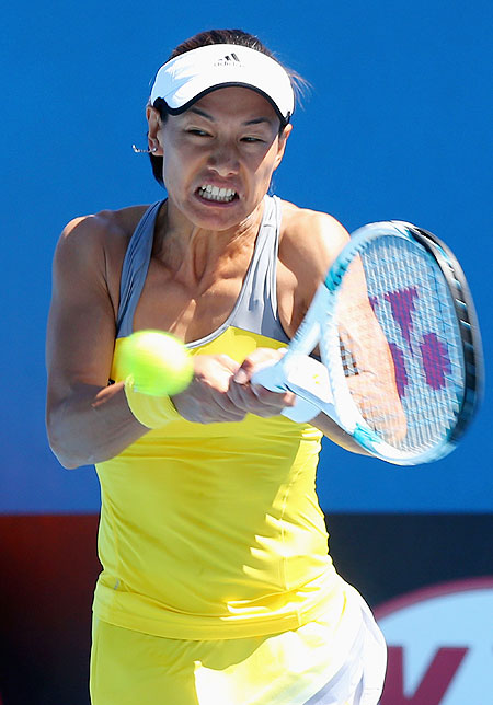 Kimiko Date-Krumm of Japan plays a backhand in her first round match against Nadia Petrova of Russia