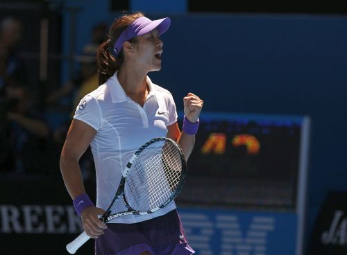 Li Na of China celebrates defeating Olga Govortsova of Belarus in their women's singles match at the Australian Open